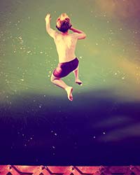 Man-jumping-into-water